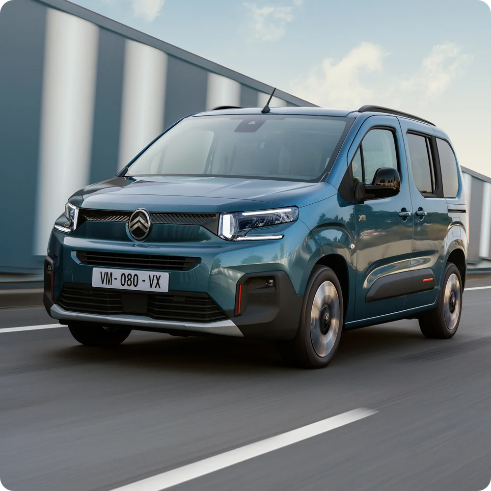 Front view Kiama Blue ë‑Berlingo driving showing electric range, efficiency, safety and confident long‑distance freedom