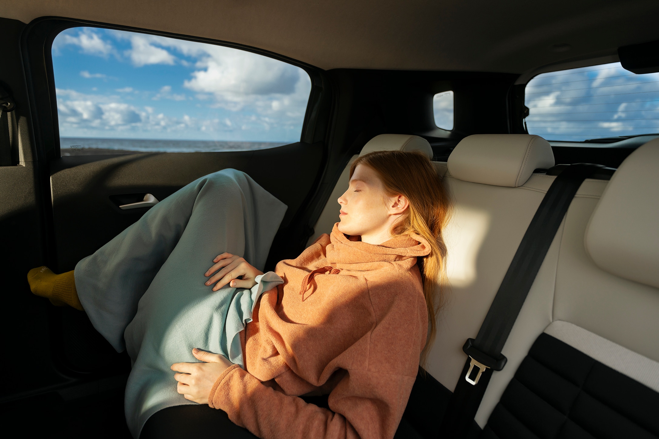 Rear interior view of Citroën ë-C3 Aircross SUV showcasing spacious seating for relaxed long‑journey comfort and affordable everyday mobility.