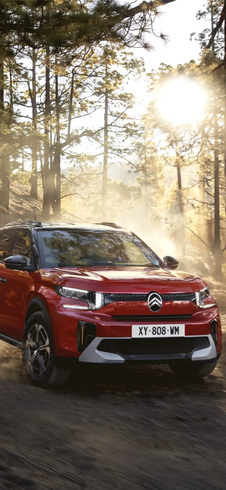 Front driving view of Citroën C3 Aircross SUV on a forest trail highlighting rugged performance for confident, versatile and affordable mobility.