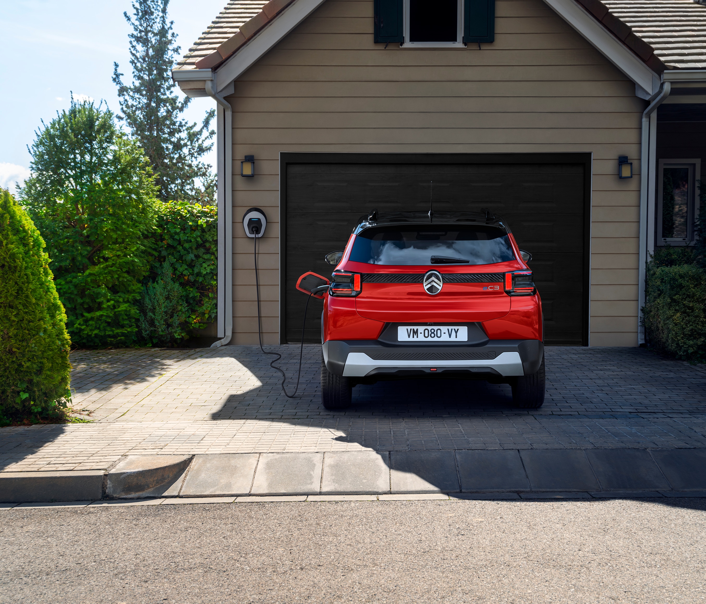 Rear view of Citroën C3 SUV charging at home, highlighting convenient, efficient and affordable everyday urban mobility.