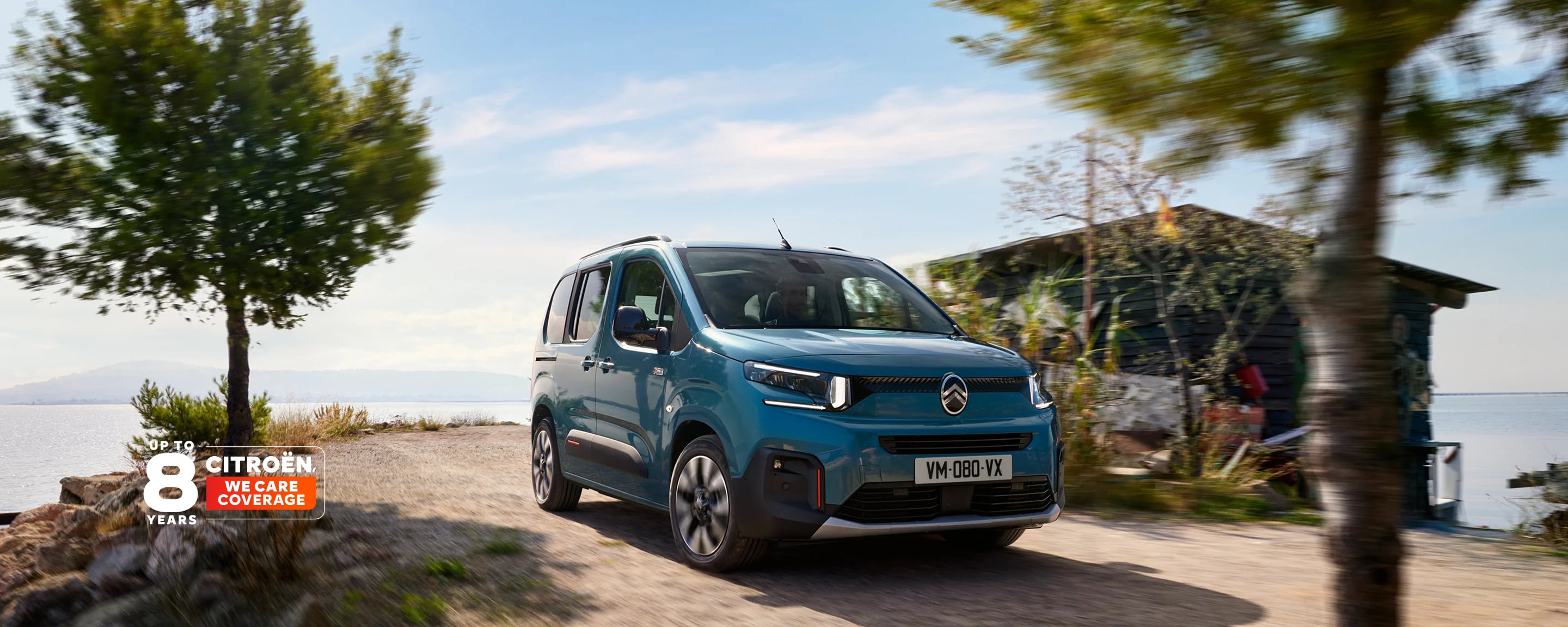Three‑quarter front view ë-Berlingo showing family‑friendly design, comfort, safety, connectivity & modern confident presence